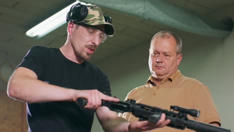 a man learns how to shoot a rifle at the shooting range