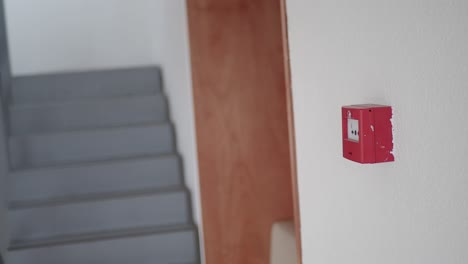 fire alarm on wall in stairwell