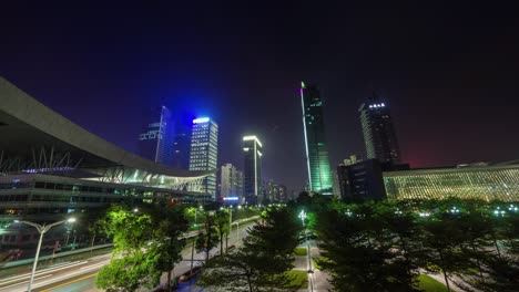 china luz nocturna ciudad de shenzen centro cívico bloque redondo panorama 4k lapso de tiempo
