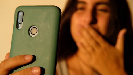 defocused-natural-girl-talking-on-the-cell-phone-camera