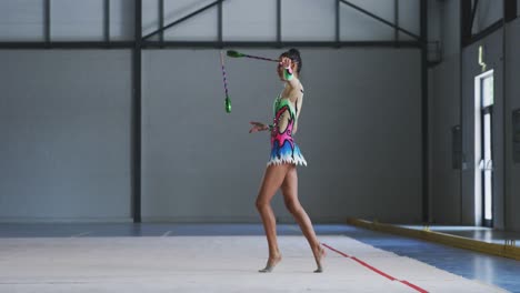 female gymnast performing at sports hall