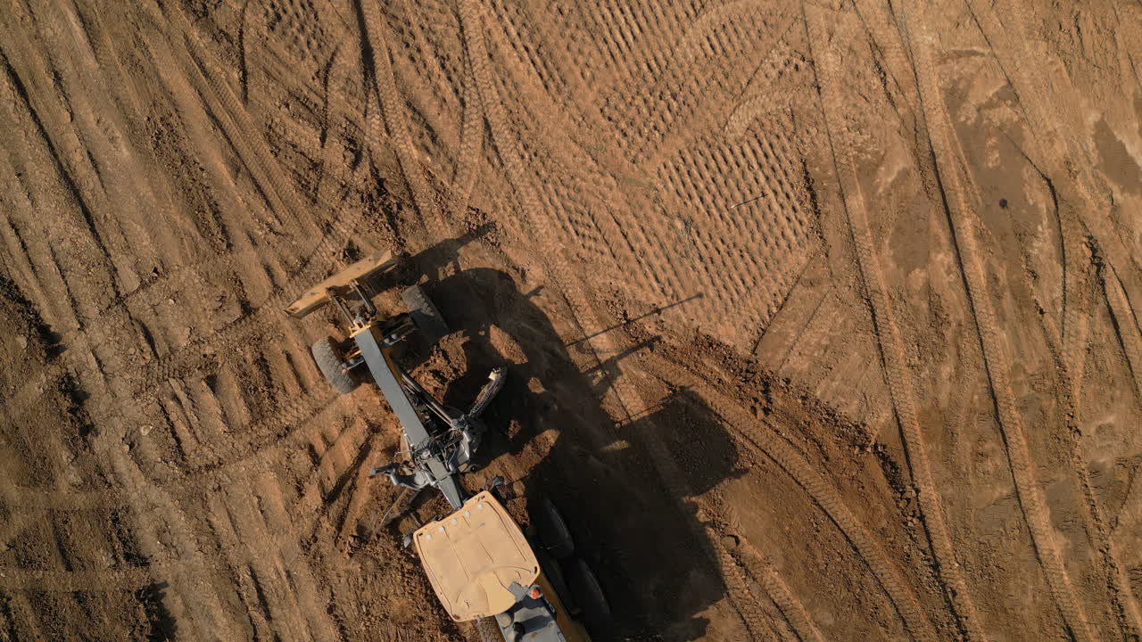 Aerial View of Construction Site with Grader