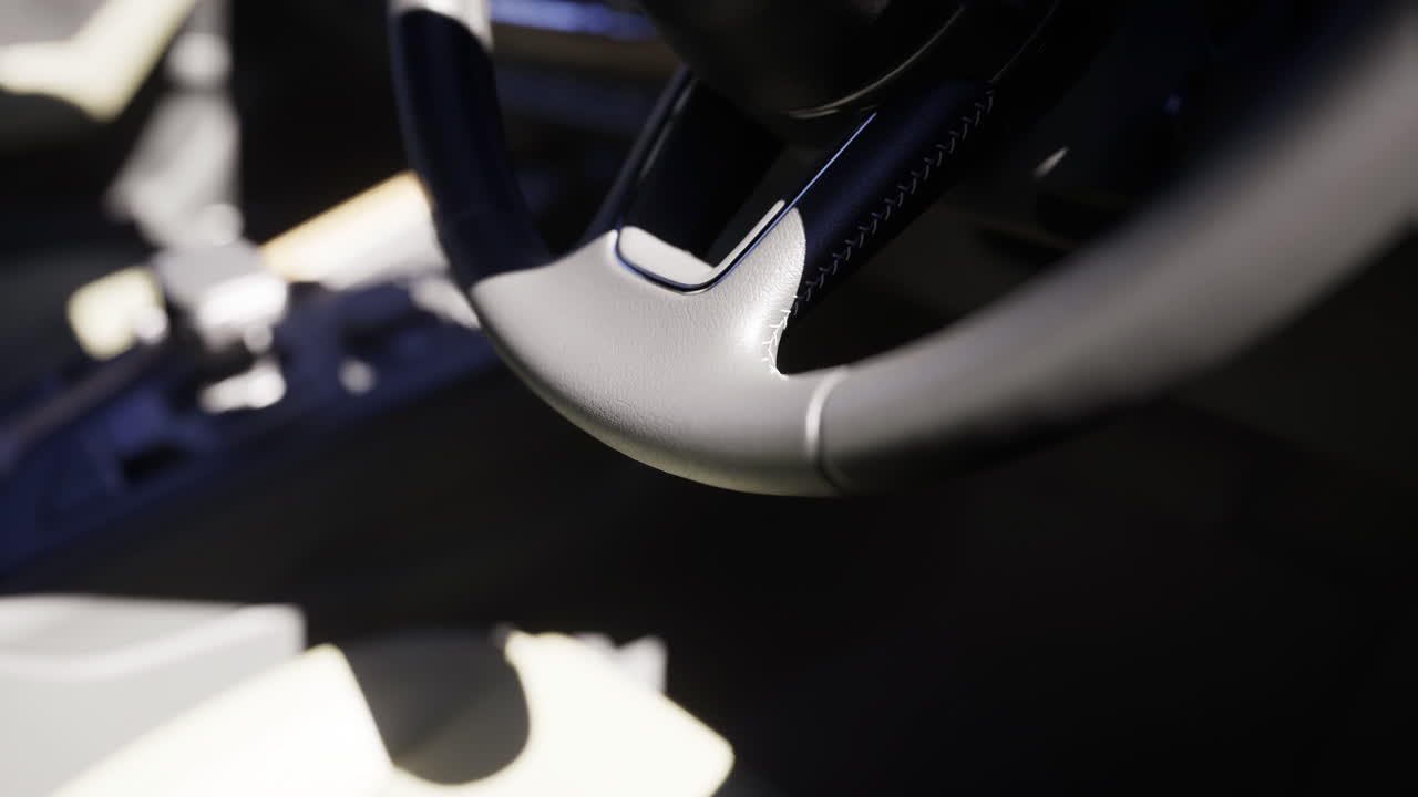 Close view of a modern car steering wheel and interior details