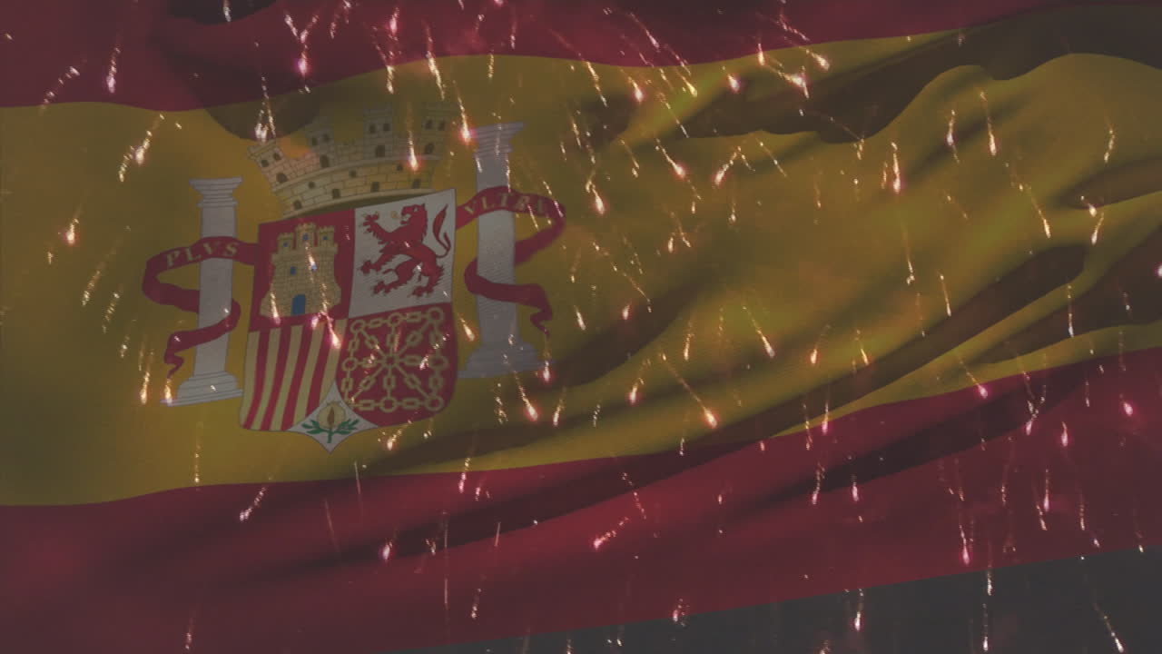 불꽃놀이 위에서 흔들리는 스페인 국기의 애니메이션