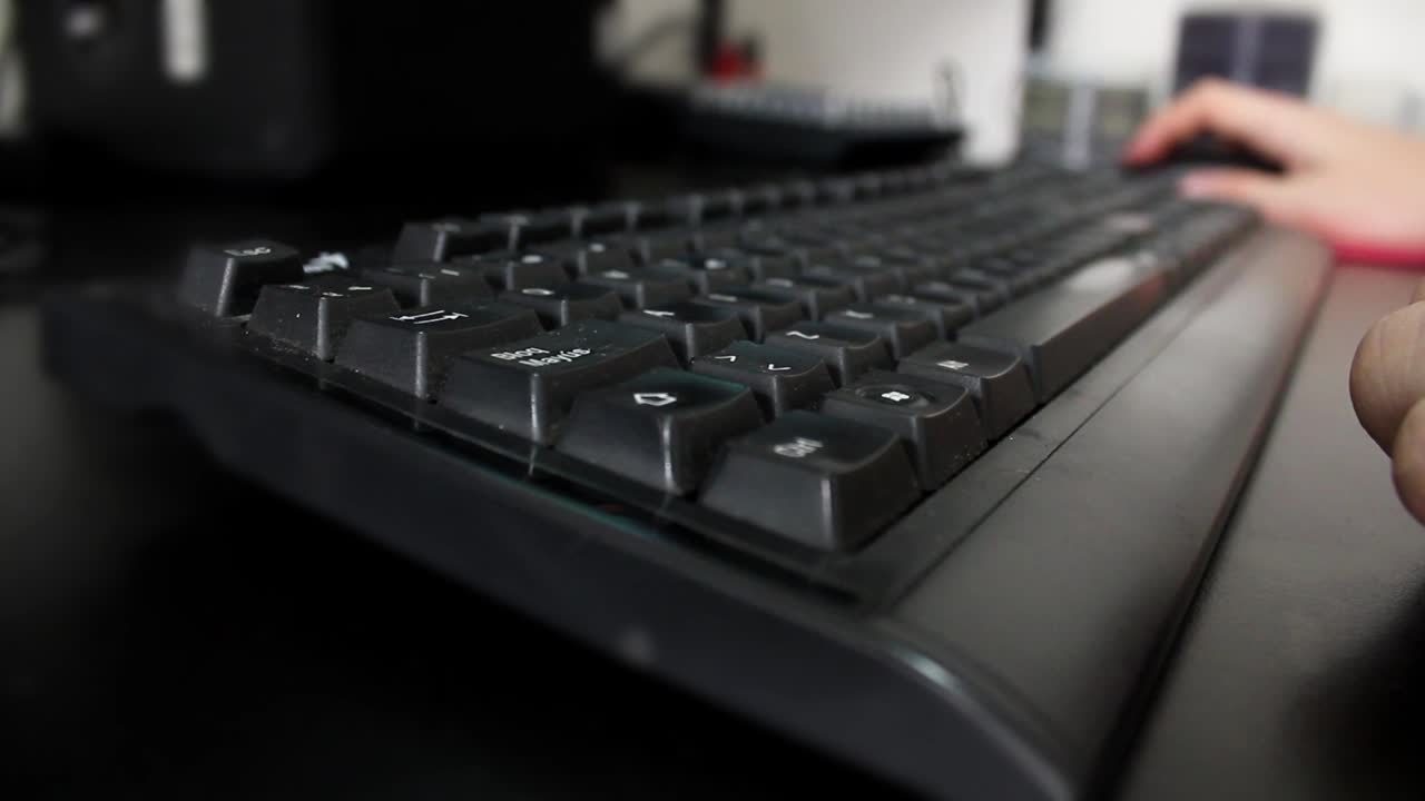 Close-Up of Hands Typing on a Computer Keyboard