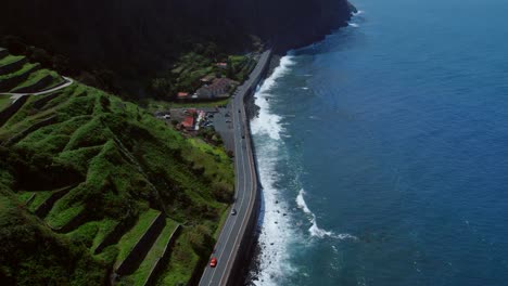coastal road with terraced hills