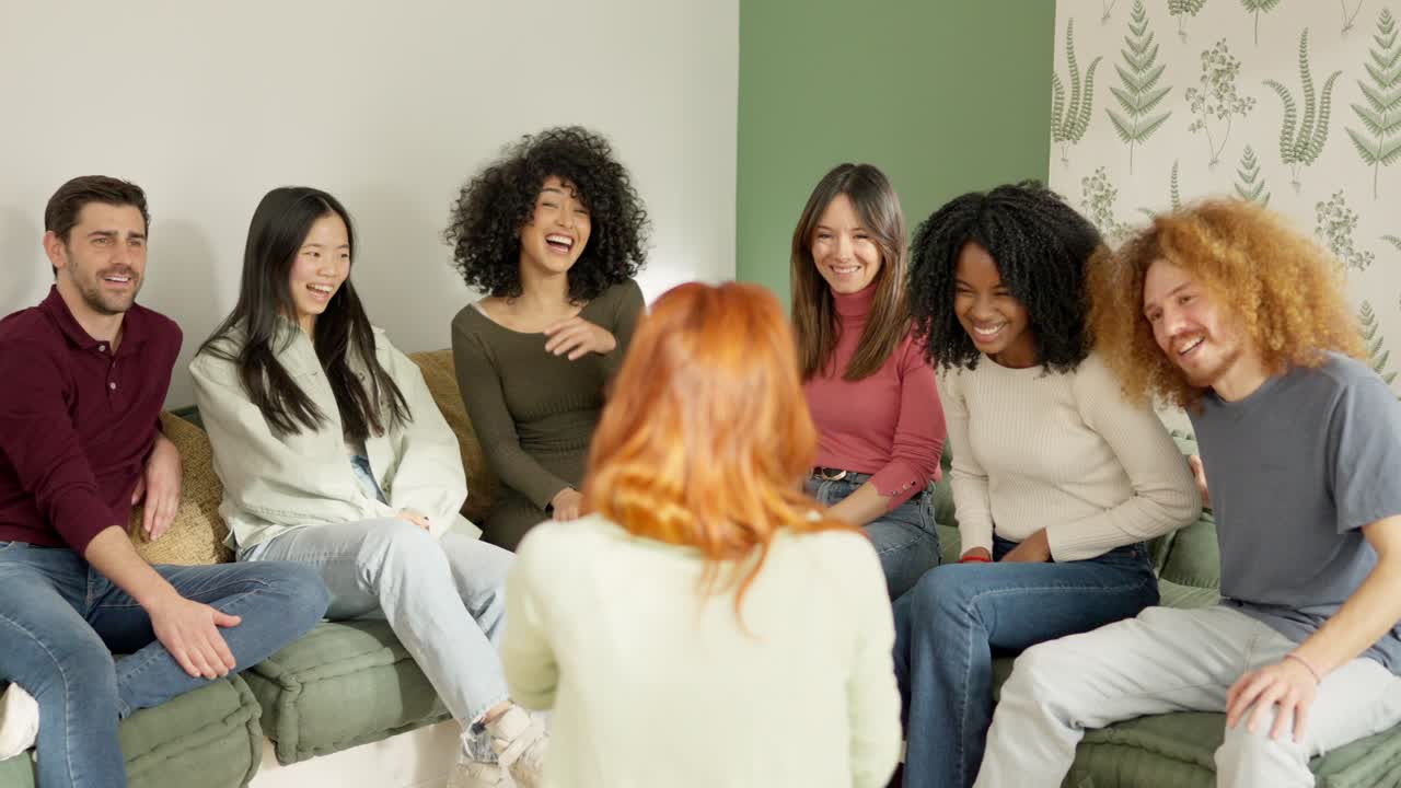 Woman explaining something funny to a multiethnic group of friends