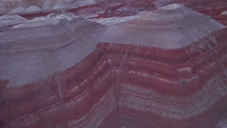 Bentonite-Hills,-Utah,-aerial-4k-drone-rise-and-flyover-view-of-colorful-mars-like-landscape