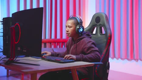 teenager gaming at night