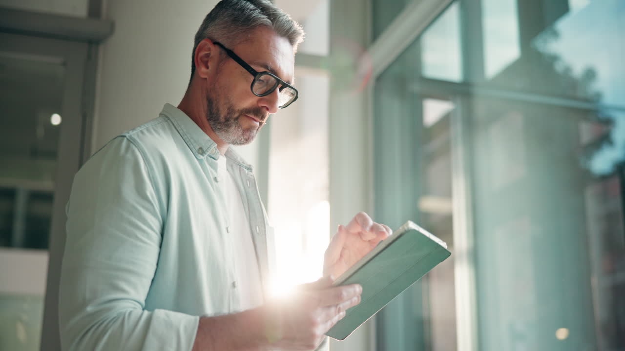 Man working on tablet in office