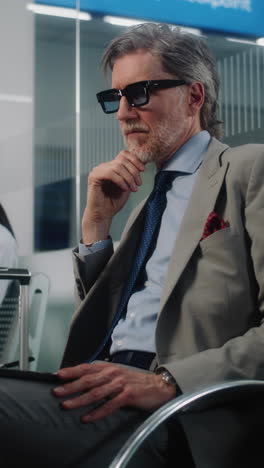 businessman waiting in airport lounge
