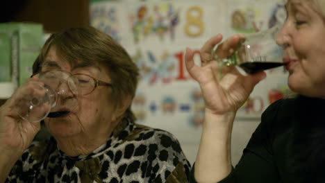 two women clanging glasses