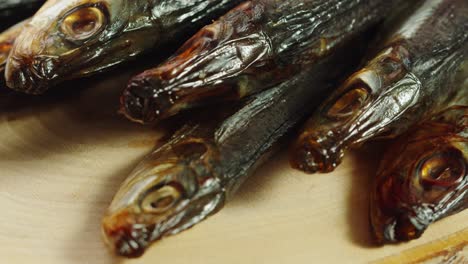 smoked fish on wooden board