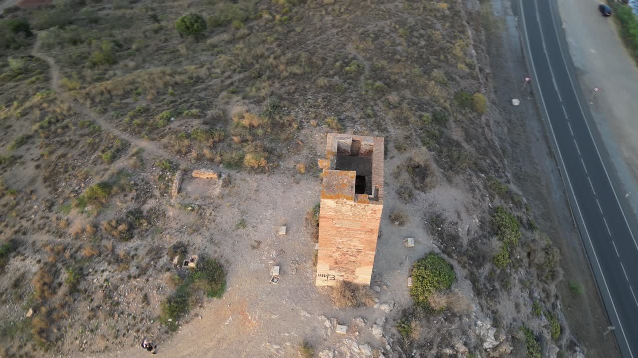 Experience the historic Tower of Jaral in Almayate Bajo from a mesmerizing drone's-eye view