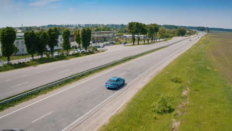 New fulle electric Audi on road. Audi is driving on the outskirts of town