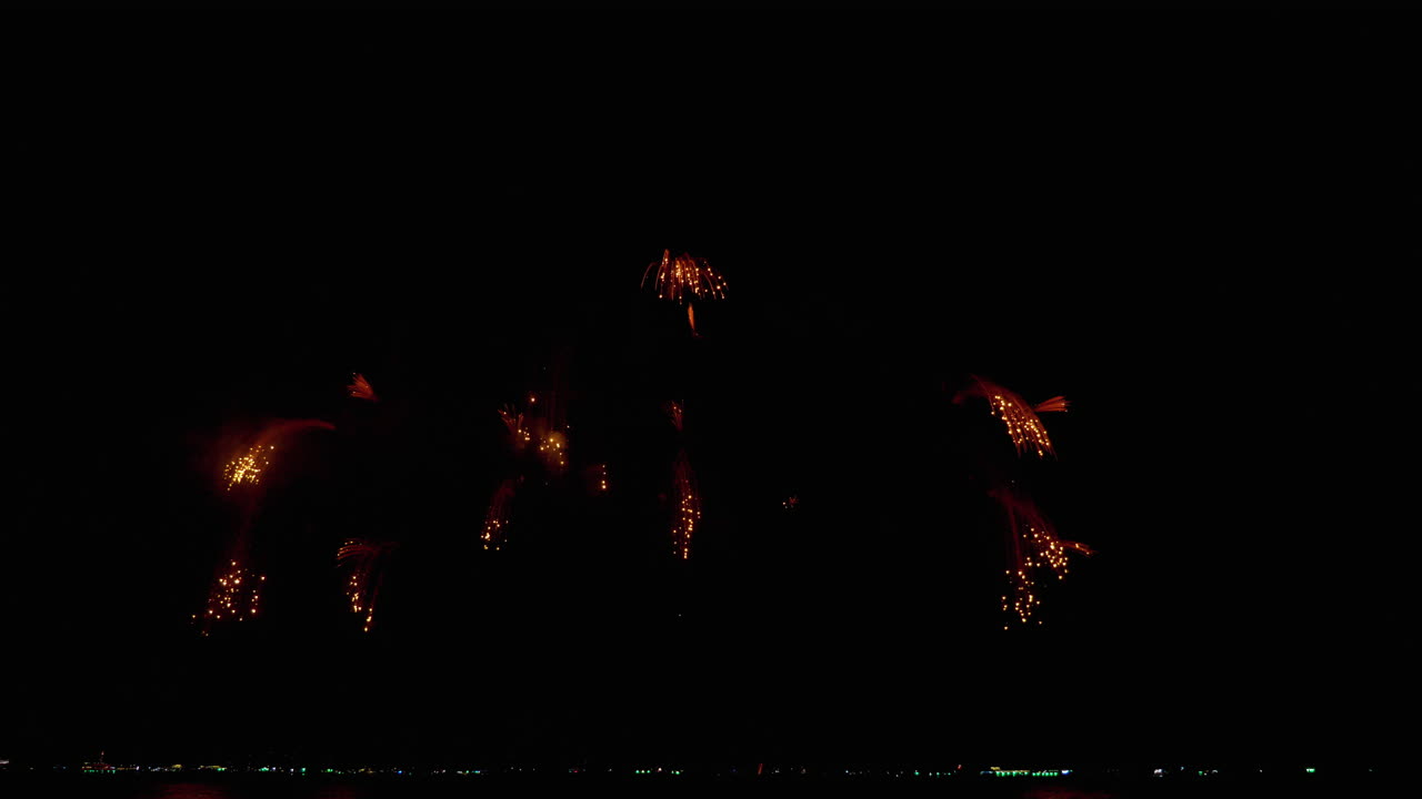 Large number of photos of fireworks during New Year's Eve being shot on the coast