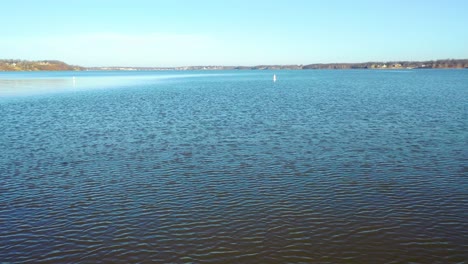 pov from boat driving towards two floating no wake buoys on table rock lake in midwest missouri