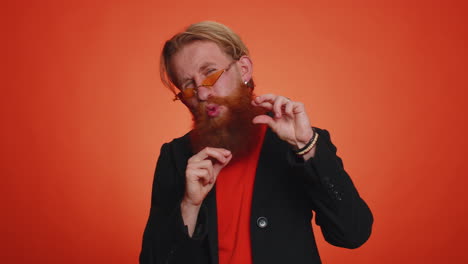 man showing a little bit gesture with sceptic smile, showing minimum sign, measuring small size