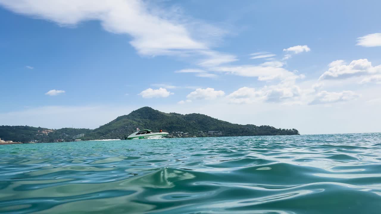 A serene snorkeling experience in Phuket, Thailand, capturing vibrant underwater views and scenic coastal landscapes under bright daylight