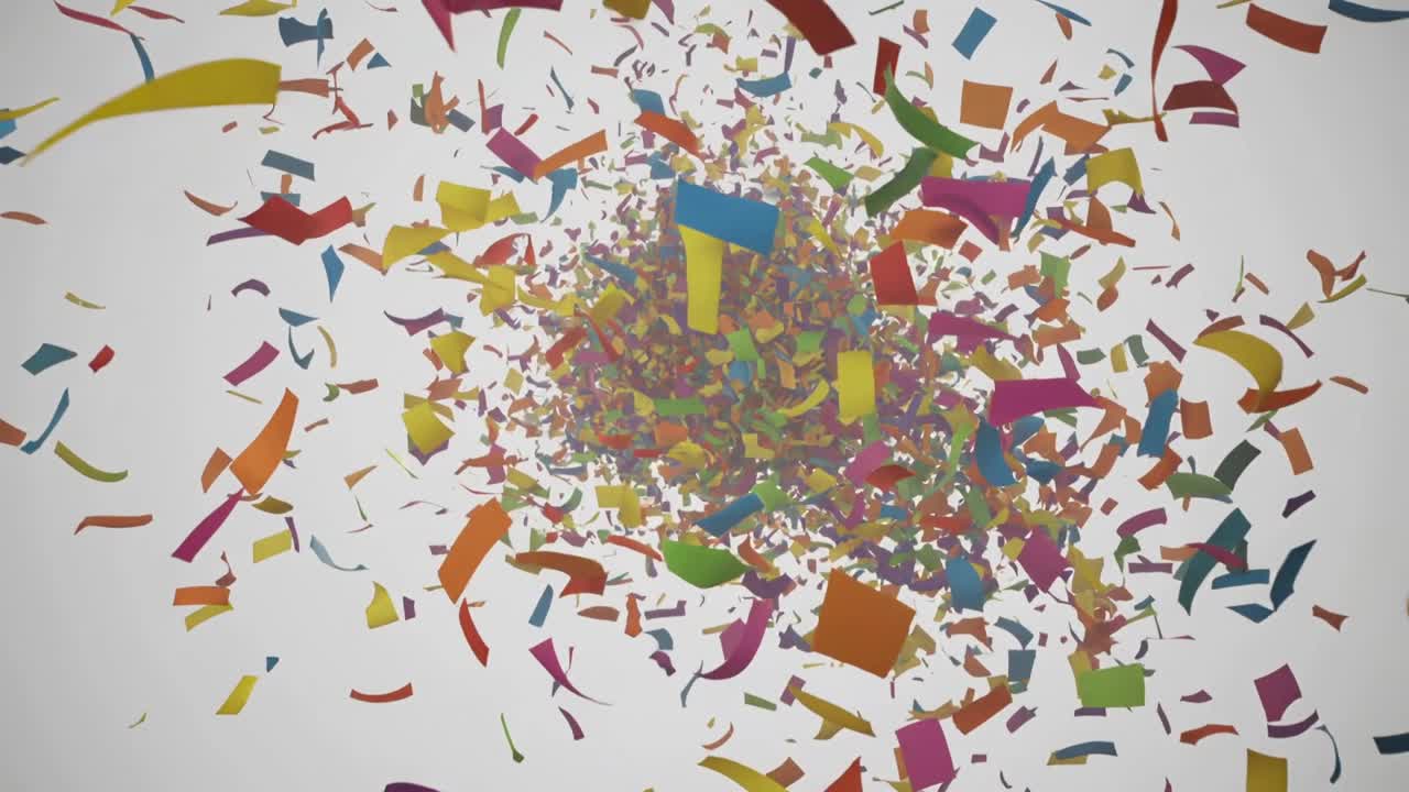 Bursting dense cloud of multicolored confetti expanding after sudden release on light gray backdrop