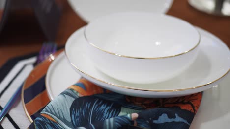 white plates with gold rims - elegant table setting