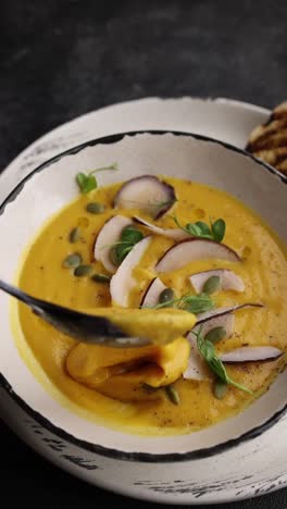 pumpkin coconut soup with toppings