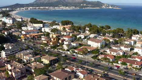 car traffic on city street along coast of seaside residential area