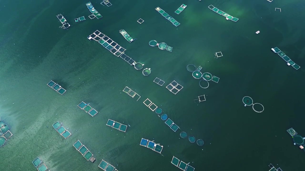 Top view drone shot of fish farms and volcanic scenery in Batangas with cinematic atmosphere.