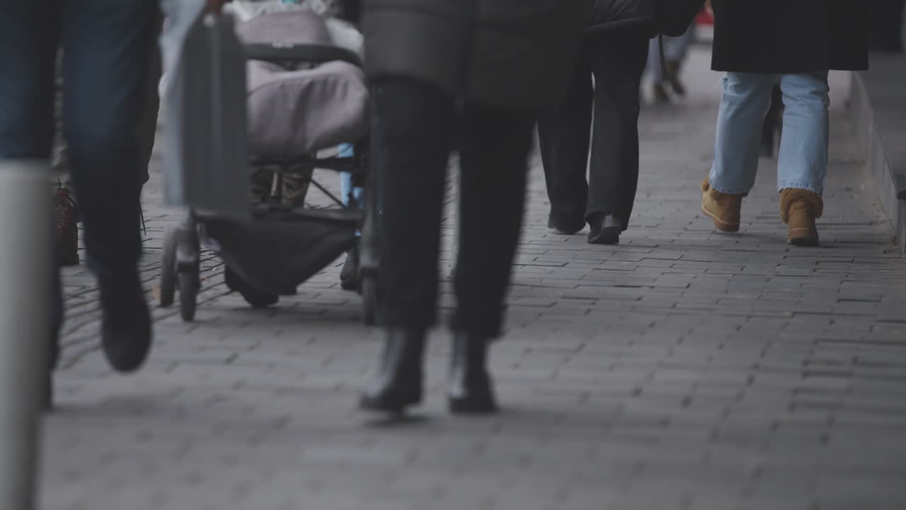 Pedestrians Walking on City Street