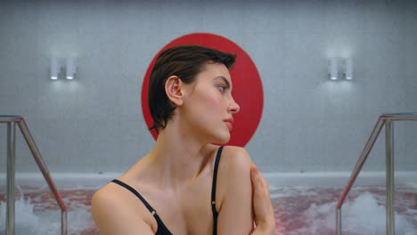 woman relaxing in a modern spa hot tub