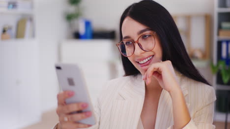 Happy-Woman-Browsing-Social-Media-on-Smartphone