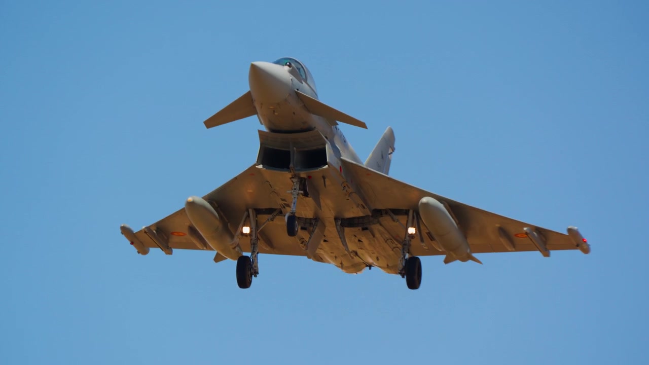 Fighter jet on approach low over airfield field