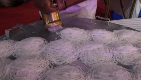 process of cooking diyappam also known as string hopper, indiappa noolputtu nool