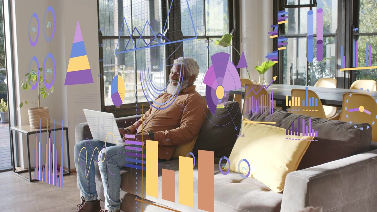 Man sitting on sofa typing, scrolling, reviewing finance charts over laptop, adjusting glasses