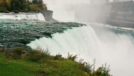 slow motion 120 fps video: the niagara river flows into the flow of niagara falls