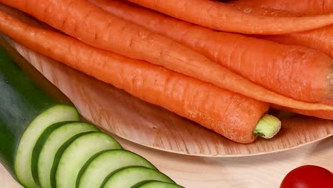 a colorful arrangement of carrots, zucchini, potatoes, cauliflower, radishes, and peppers in a bright display.