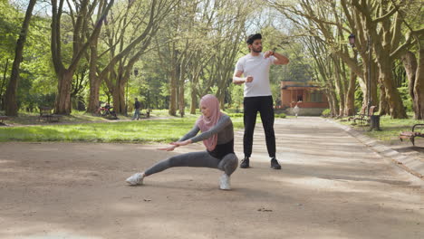 couple exercising in park