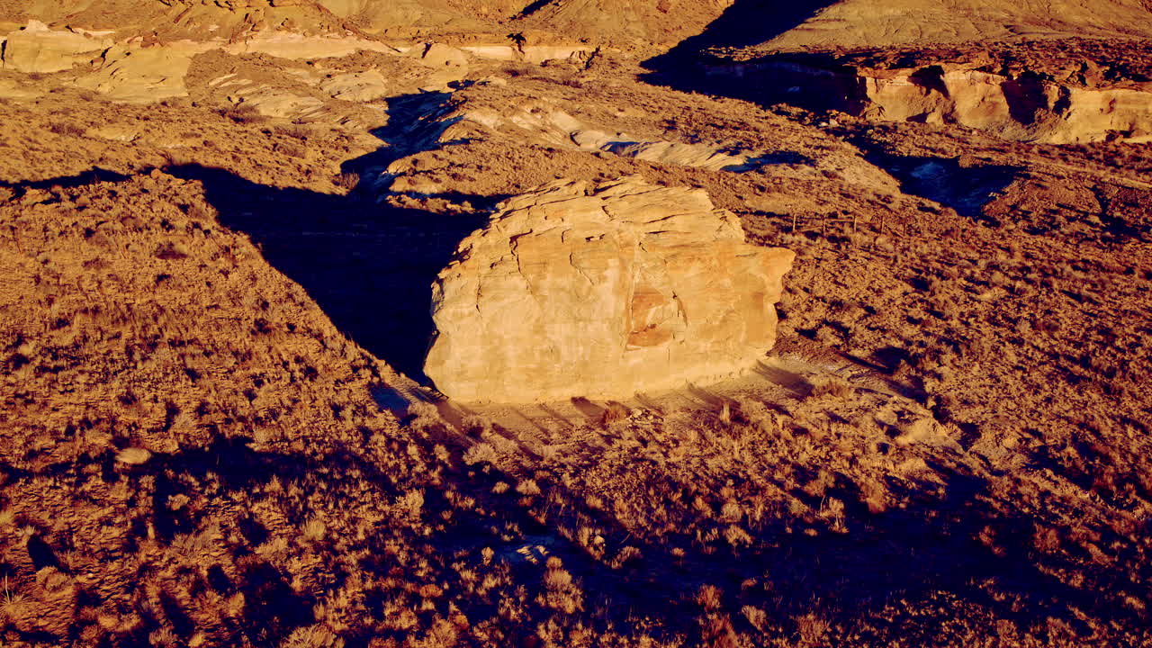 A slow aerial drone shot reveals the breathtaking multi-hued hills and fascinating hoodoos near the Utah-Arizona border.