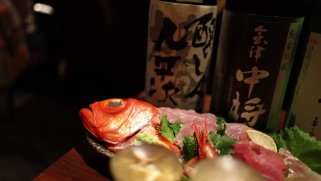 close-up of various sashimi on a wooden board