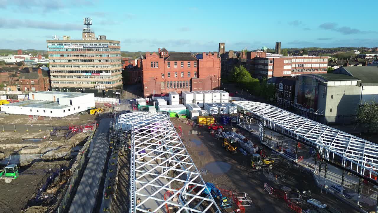 Modern public transport construction site aerial view over town urban business regeneration project