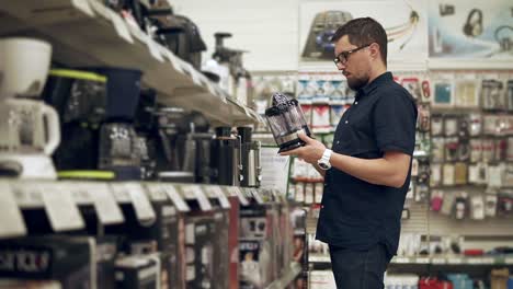 man shopping for kitchen appliances in a store