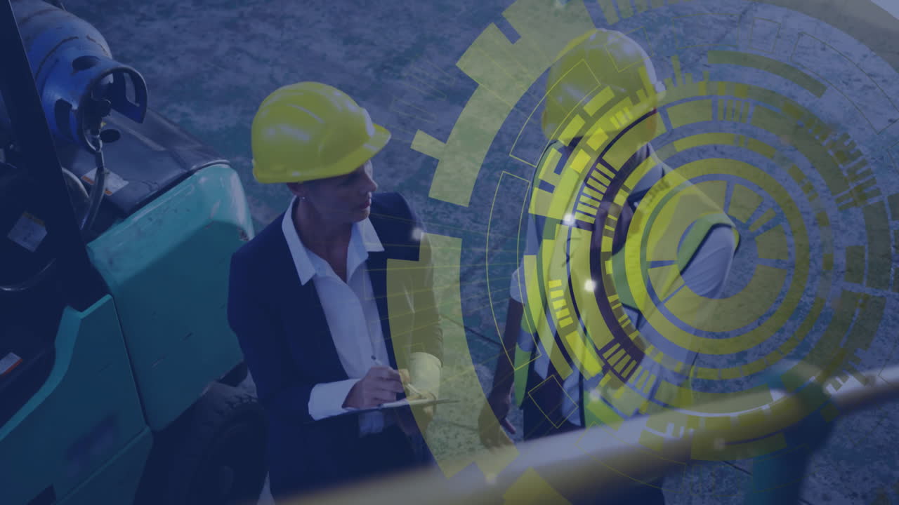 Engineer in hard hat reviewing plans with digital gears animation overlay
