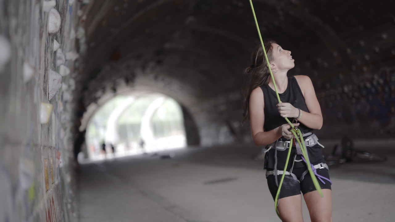 Spanish woman analyzing rock height before to climbing at Barcelona