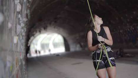 Spanish-woman-analyzing-rock-height-before-to-climbing-at-Barcelona