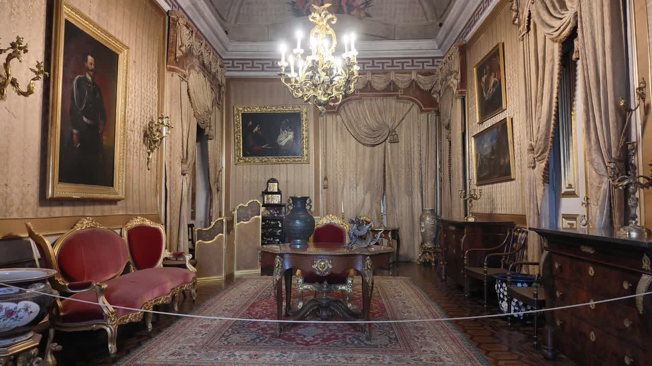 Luxurious interior of Palace of Ajuda in Lisbon, Portugal, showcasing opulent furniture, decor, and artwork, reflecting rich history