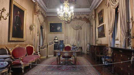 luxurious interior of palace of ajuda in lisbon, portugal, showcasing opulent furniture, decor, and artwork, reflecting rich history