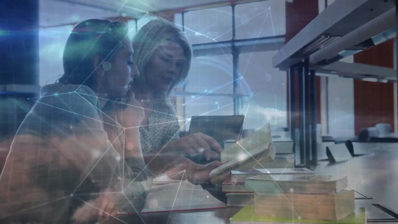 Two Women Studying Together with Digital Network Overlay