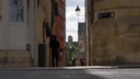 defocused shot of pedestrians and traffic on high street in oxford 01