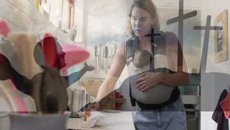 carrying baby in sling, mother cleaning with animation of religious symbols
