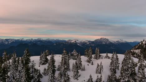 Snowy-Mountain-Peaks,-Dramatic,-Colorful-Sunset-Sky